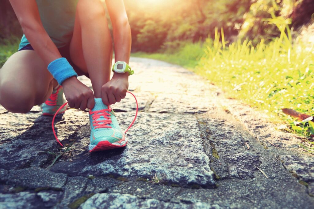 Tying up our running shoes ready to get sweaty.